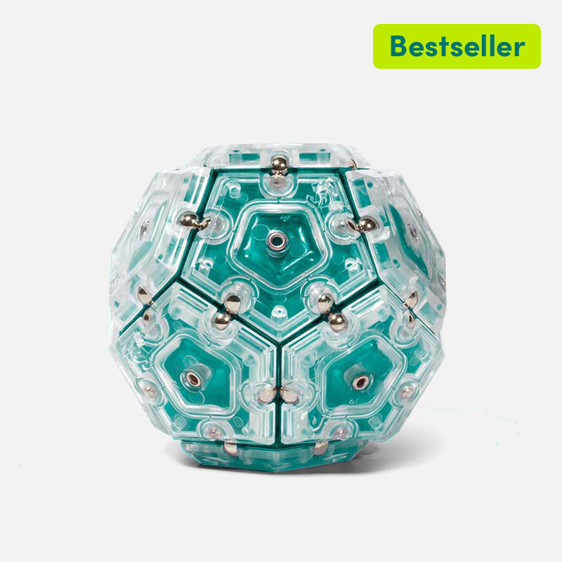 Speks magnetic sphere broken into pieces on a desk